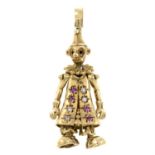 A 9ct gold ruby and cubic zirconia articulated clown pendant.