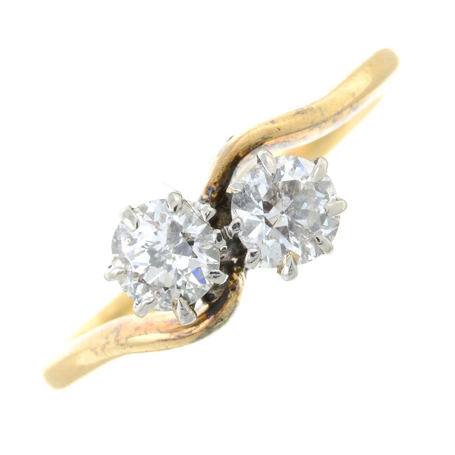 A mid 20th century 18ct gold old-cut diamond two-stone ring.