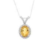 An 18ct citrine and diamond cluster pendant, suspended from a chain.