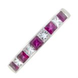 A platinum ruby and diamond half eternity ring.