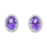 A pair of 18ct gold amethyst and diamond cluster earrings.