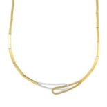 A 9ct gold bi-colour necklace, with crossover loops.