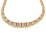 A 1970s 9ct gold tri-colour fringe necklace.