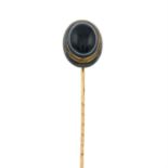 A late 19th century bulls-eye agate mourning stick pin.
