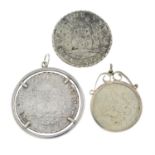 A selection of coin pendants, charms and fobs.