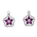 A pair of brilliant-cut diamond and ruby floral drop earrings.