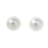 A pair of cultured pearl stud earrings.