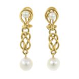 A pair of cultured pearl earrings.