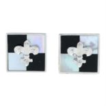 A pair of silver mother of pearl and onyx cufflinks, by P.D Man.