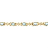 A 9ct gold blue topaz fancy-link bracelet.