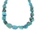A turquoise bead necklace.