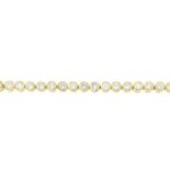 An 18ct gold brilliant-cut diamond line bracelet.