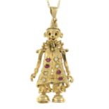 A 9ct gold clown pendant, with articulated limbs, synthetic ruby and cubic zirconia highlights,