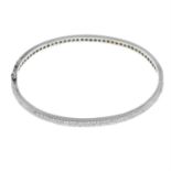 An 18ct gold pave-set diamond hinged bangle.