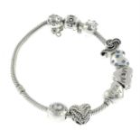 A charm bracelet, suspending four charms and a safety link, by Pandora, with two further charms.