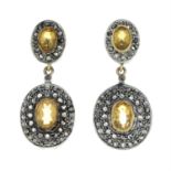 A pair of citrine and diamond earrings.