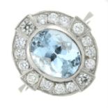 A platinum aquamarine and diamond cluster ring.