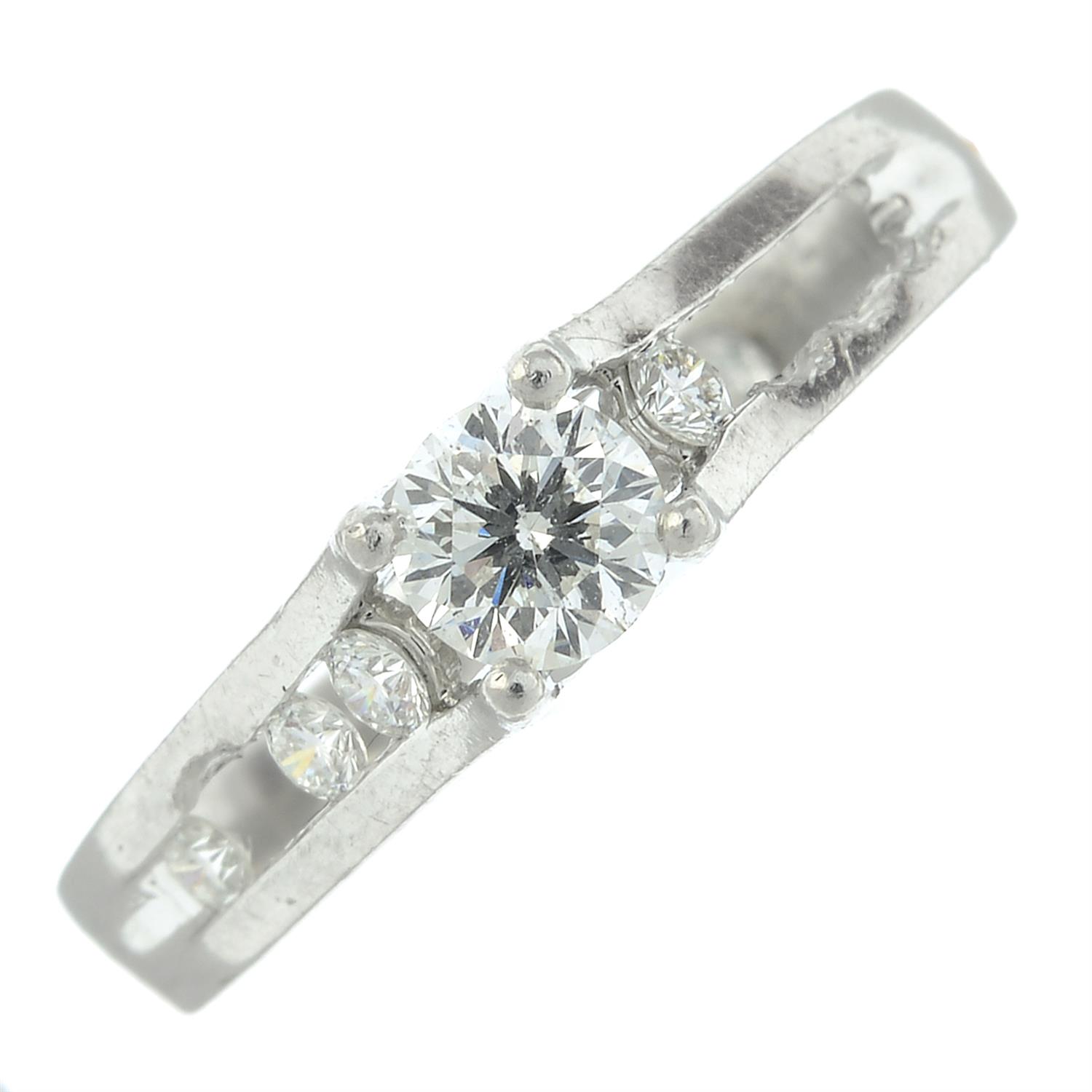 A platinum brilliant-cut diamond dress ring.