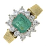 A 1970s 18ct gold emerald and diamond cluster ring.