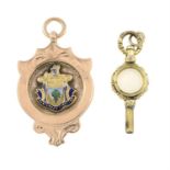 A late 19th century white chalcedony watch key and an early 20th century 9ct gold and enamel