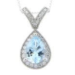 An 18ct gold aquamarine and diamond pendant, with trace-link chain.