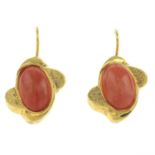 A pair of coral earrings.