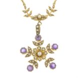 An early 20th century 15ct gold seed and split pearl necklace, suspending a detachable amethyst,