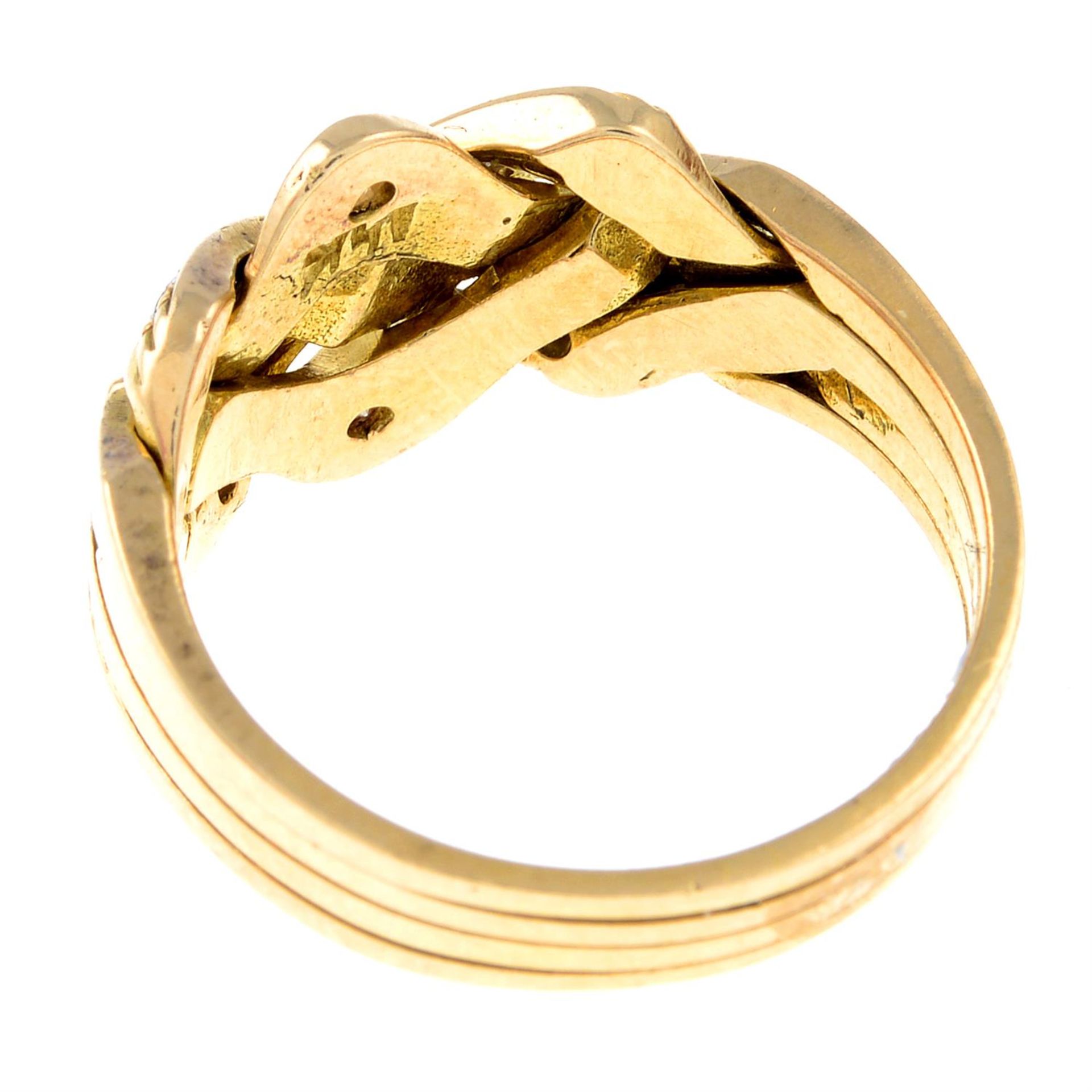 A circular-cut diamond four-band puzzle ring. - Image 2 of 2
