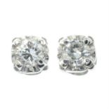 A pair of brilliant-cut diamond stud earrings.