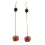 A pair of coral and onyx drop earrings.