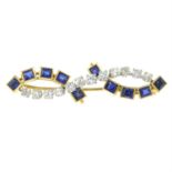 An early 20th century brilliant-cut diamond and sapphire brooch, depicting an undulating line.