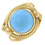 A reconstituted turquoise dress ring.