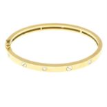 An 18ct gold brilliant-cut diamond bi-colour bangle.