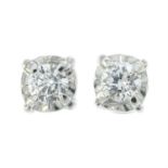 A pair of brilliant-cut diamond stud earrings.