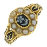 A mid Victorian gold carved agate, split pearl and enamel mourning ring, depicting a