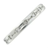 A platinum brilliant-cut diamond band ring.