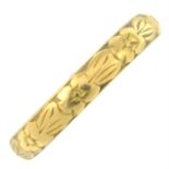 A 1960s 22ct gold band ring, with floral motif.