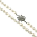 A cultured pearl single-strand necklace, with sapphire and diamond cluster clasp.