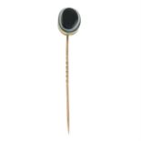 An early 20th century gold banded agate stickpin.