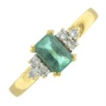 An 18ct gold emerald and diamond dress ring.