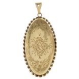 A 1980s 9ct gold locket pendant, with engraved floral detail.