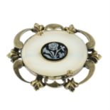 A chalcedony and paste mourning brooch.
