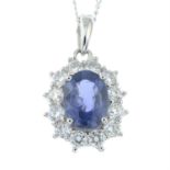An 18ct gold sapphire and diamond cluster pendant, with trace-link chain.