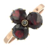 A garnet and rose-cut diamond trefoil cluster ring.