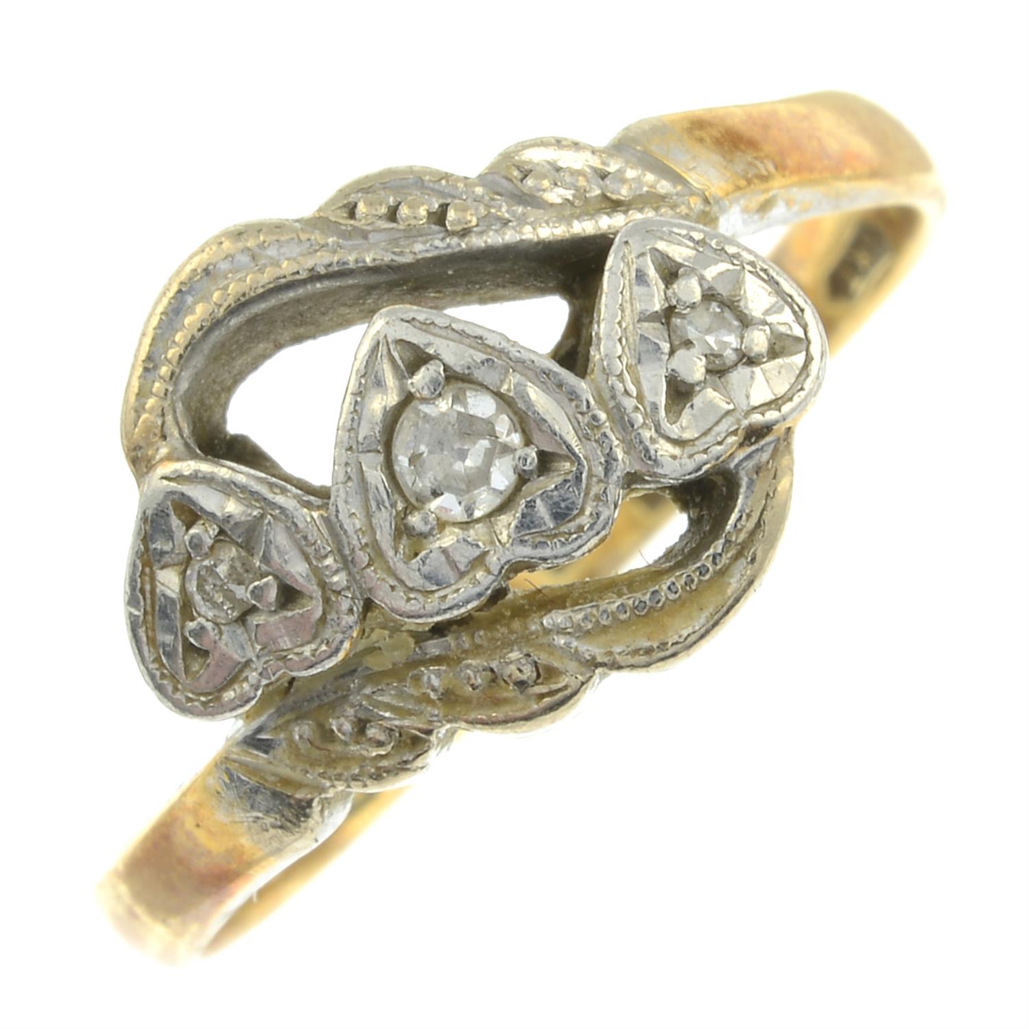An 18ct gold single-cut diamond heart crossover ring.