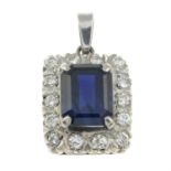 A sapphire and brilliant-cut diamond cluster pendant.