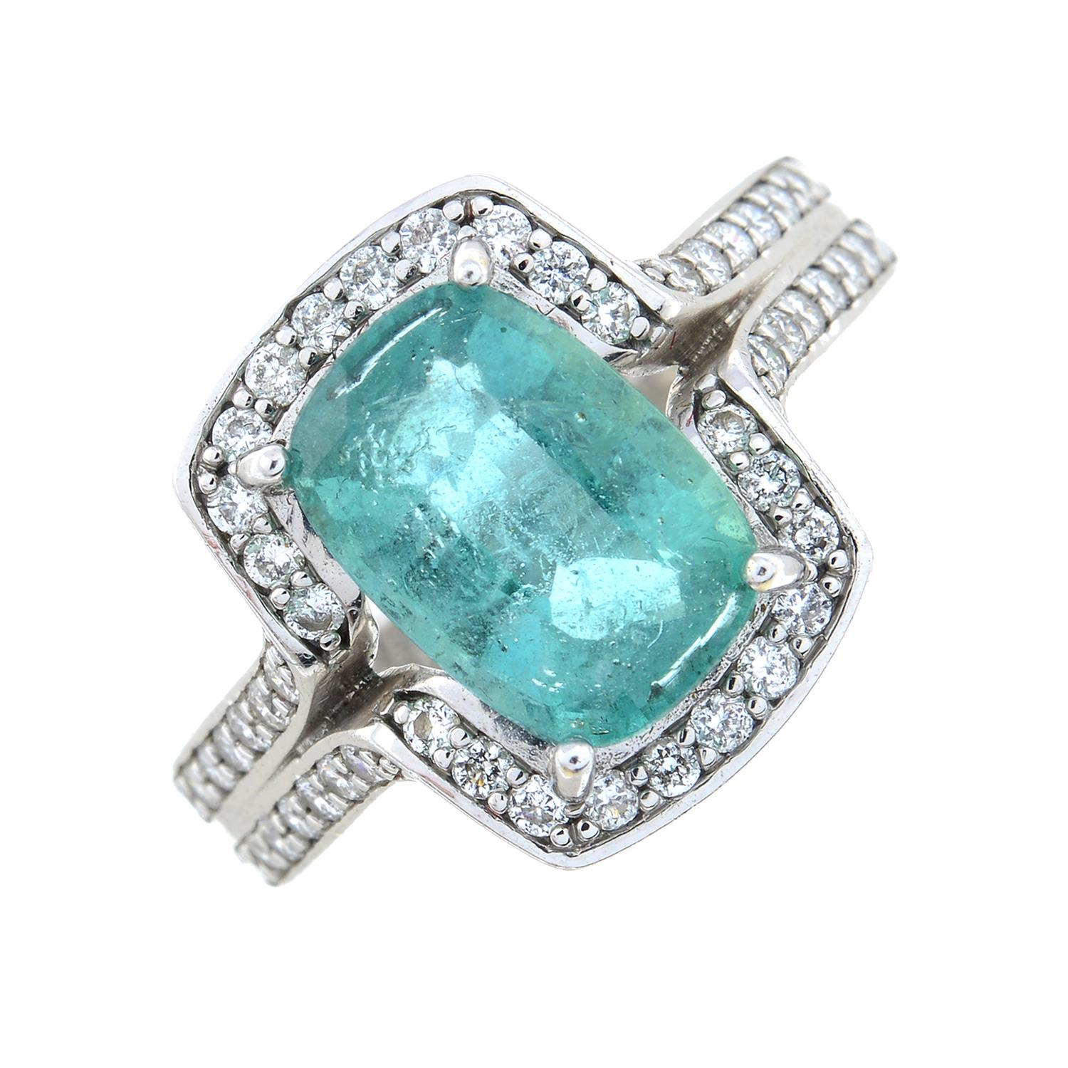 An emerald and brilliant-cut diamond dress ring.