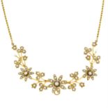 An early 20th century gold seed and split pearl floral necklace.