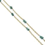 A fancy-link necklace, with free-form green gem spacers.