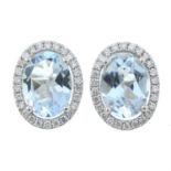 A pair of 18ct gold aquamarine and diamond cluster stud earrings.